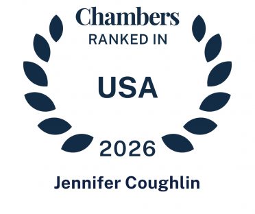 Dark blue icon in the shape of a laurel wreath that says Chambers Ranked In USA 2026 Jennifer Coughlin.